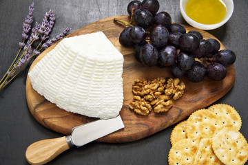 appetizer with ricotta. lavender, grapes, walnuts, olive oil and