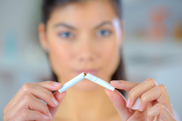Woman trying to quit smoking - obrazy, fototapety, plakaty