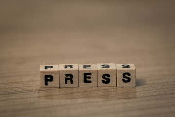 Press in wooden cubes