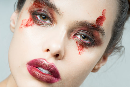 Girl with original make-up of blood