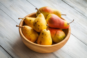 fresh ripe organic pears on a rustic wooden table