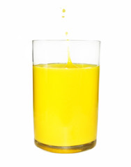 Orange juice with splash in glass