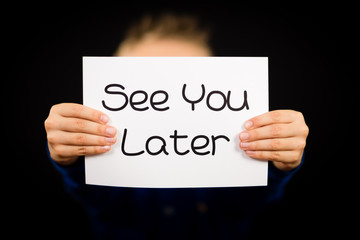 Child holding See You Later sign