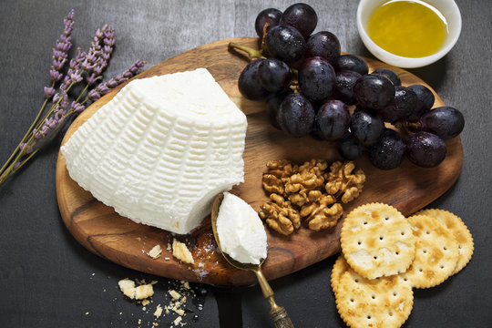 appetizer with ricotta. lavender, grapes, walnuts, olive oil and
