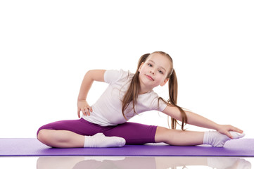 Fototapeta premium Little girl doing fitness exercises