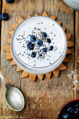 Obraz na płótnie Canvas vegan coconut Chia seed pudding with blueberries