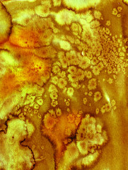 Gold watercolor stained background 