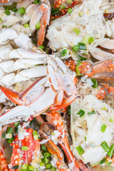 Malaysian dish clear crab soup in an oblong plate over wooden background