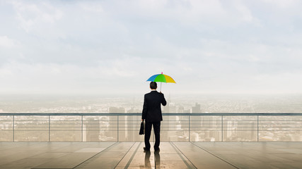 Businessman with umbrella