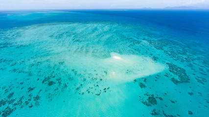 Aerial view of Great Barrier Reef with coral sand cay beach, Australia