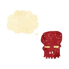cartoon spooky skull with thought bubble