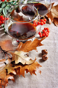 Glass of cognac, Thanksgiving or autumn table setting. Selective focus