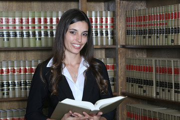Young female law student in law library