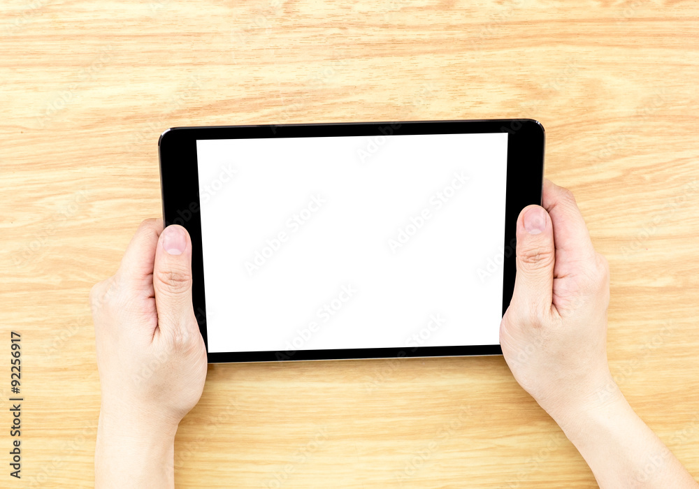 Aufkleber hand holding tablet on table top,mock up for adding your design