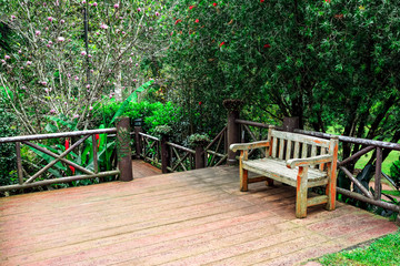 Beautiful wooden garden chair in the garden