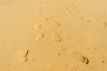 Fototapeta na wymiar Foot step on sand