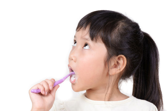 Little asian girl brush teeth