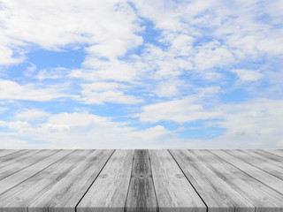 Vintage wooden board empty table in front of sky background. Perspective wood floor over sky - can be used for display or montage your products. beach & summer concepts.