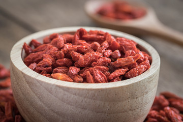 Goji berries in wooden bowl