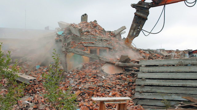 Special machinery destroys old buildings