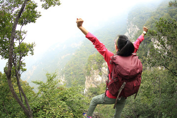 cheering hiking woman hiker open arms on chinese great wall mountain