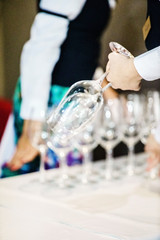 Waiter hand with glass of champagne