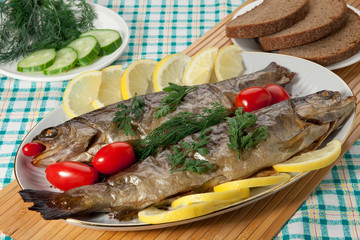 Trout baked in the oven on a country table