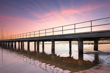Fototapeta premium Jetty with Tide Out at Sunset.
