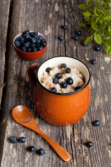 Healthy breakfast: oats porridge with blueberry