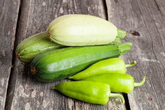Pepper and Zucchini on wooden background