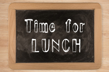 Obraz premium Time for lunch - chalkboard with outlined text - on wood