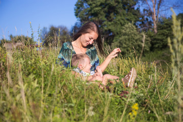 Young woman with son have fun outdoors