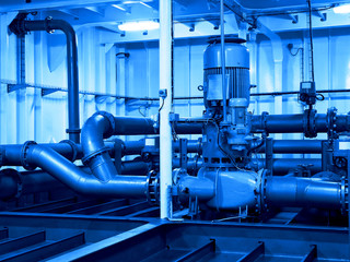 Industrial electric water pump and pipes - industry concept.