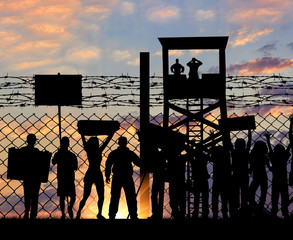 Silhouette protesting refugees near the border
