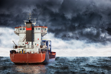 Cargo ship at sea during a storm. © Nightman1965