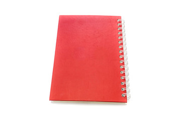 Red notebook isolated on white background.