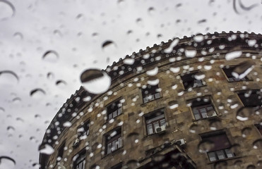 View of Historical Museum of Serbia in Belgrade through window with rain drops