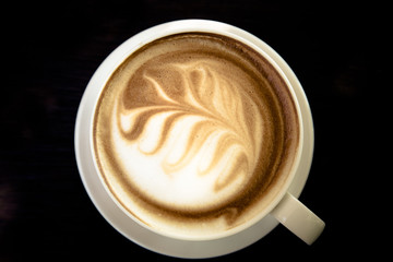 art latte coffee on white cup