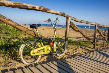 Nice retro vintage bicycle near beach, sunny day