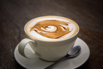 art latte coffee on white cup