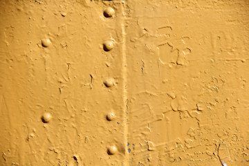 Rusty iron wall covered with paint