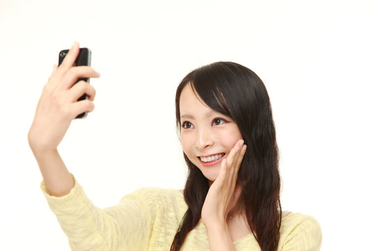 Japanese woman takes a selfie