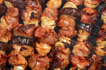 barbecue from meat and vegetables on fire