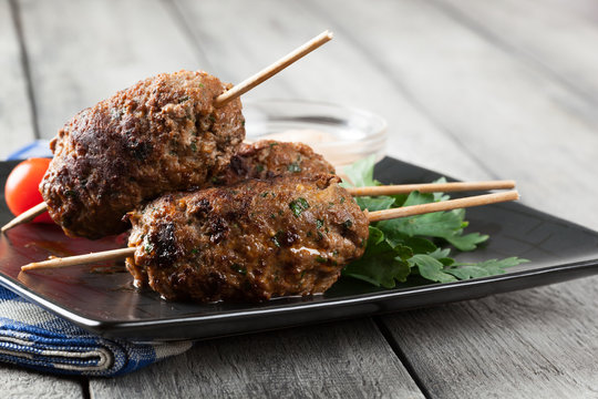 Barbecued kofta with vegetables on a plate