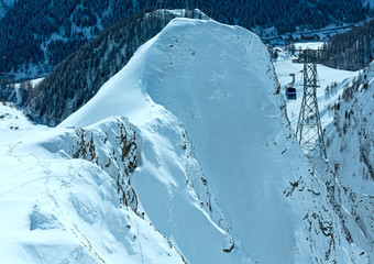 Ski lift between in winter mountain (Austria).