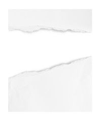 close up of a white ripped piece of paper on white background