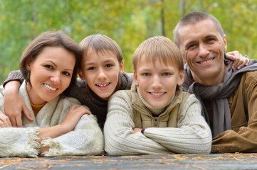Happy family in autumn forest