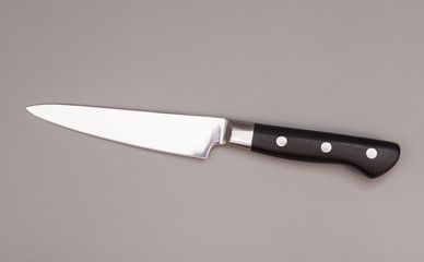 knife over gray background