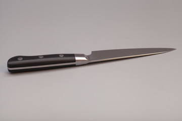 knife over gray background