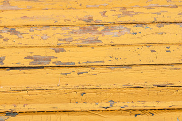 Vintage wood background with peeling  yellow  paint